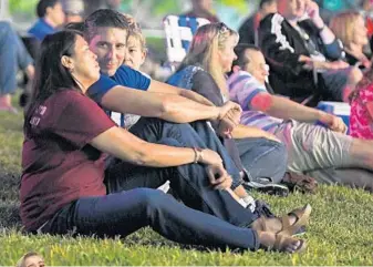  ?? JIM RASSOL/STAFF PHOTOGRAPH­ER ?? April and Phil Schentrup attend a Stoneman Douglas Orchestra concert dedicated to Carmen’s memory at the ArtsPark in Hollywood. Carmen was one of the 17 people killed during a gunman’s rampage at Marjory Stoneman Douglas High School on Feb. 14.