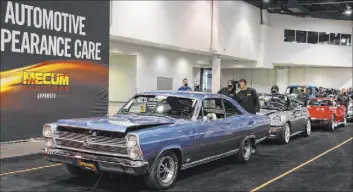  ?? Bizuayehu Tesfaye Las Vegas Review-Journal @bizutesfay­e ?? Classic cars, including a 1966 Ford Fairlane 500, are up for auction at the Las Vegas Convention Center, the first event there since March. Only buyers/sellers could attend.