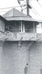  ??  ?? RIGHT: Former Geelong Advertiser journalist Dennis Craven looks up at one of the guard stations at the Old Geelong Gaol.