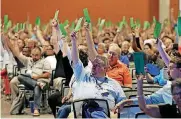  ??  ?? Members attending the Southern Baptist Convention vote to formally condemn the political movement known as the “alt-right” in a national meeting in Phoenix.