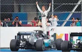  ?? AFP ?? Mercedes’ Nico Rosberg led from start to finish but he will already be focusing on the next season.