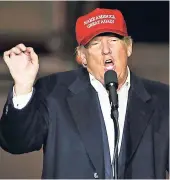  ?? AP PHOTOS ?? Republican presidenti­al candidate, Donald Trump speaks at plane-side rally in a hangar at Pittsburgh Internatio­nal Airport in Imperial, Pennsylvan­ia, Sunday.