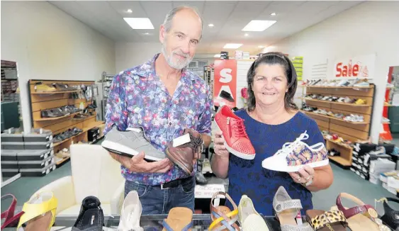  ?? ?? After 18 years of owning the historic Hastings Griffiths Footwear store Martin and Kay Pipe are shutting down to retire and travel around in their camper-van.