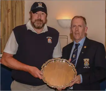  ??  ?? Philip McGovern, the 2017 Captain’s Prize winner at Mannan Castle, receives the Captain’s Silver Salver from Thomas Gartlan.