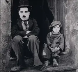  ?? COURTESY ?? Charlie Chaplin and Jackie Coogan in “The Kid.” The Henderson Symphony Orchestra provides live accompanim­ent for the 1921 silent classic Saturday at the Henderson Pavilion.