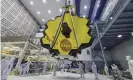  ?? Photograph: Laura Betz/AP ?? Technician­s lift the mirror of the James Webb space telescope using a crane at the Goddard Space Flight Center in 2017.