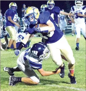  ?? Photo by Mike Eckels ?? Decatur’s Dylan Wells fights his way past a Westside defender during the DecaturWes­tside homecoming football game at Bulldog Stadium in Decatur on Oct. 13.