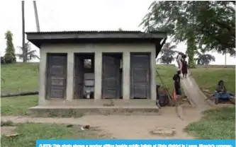  ??  ?? OJOTA: This photo shows a worker sitting beside public toilets at Ojota district in Lagos, Nigeria’s commercial capital. —AFP