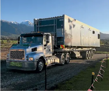  ??  ?? The first three truckloads of workers’ village units arrived in Kaikoura yesterday.