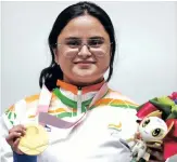  ??  ?? Avani Lekhara poses with her gold medal