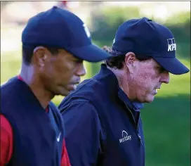  ?? CHRISTIAN PETERSEN/GETTY IMAGES FOR THE MATCH/TNS/2018 FILE ?? Tiger Woods and Phil Mickelson, golf’s longest-running rivals, have been forced by fate to have walked the same fairways and greens while competing for the same trophies and legacies for decades.