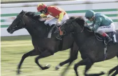  ??  ?? 0 Middle Kingdom, left, can defy top weight at Lingfield.