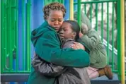  ?? AP PHOTO/BEBETO MATTHEWS ?? Derry Oliver, 17, right, hugs her mother, also Derry Oliver, Friday at a playground near their home in New York.