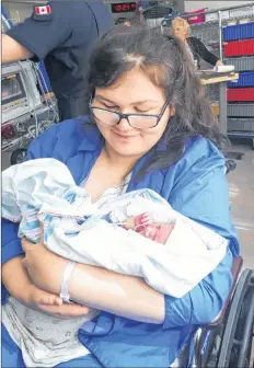  ?? SUBMITTED ?? New mom Ocean Johnstone holds her daughter, Rain. Johnstone gave birth in the car while travelling between the exits for Berwick and Coldbrook on Highway 101 en route to Valley Regional Hospital in Kentville May 15.