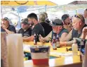  ?? STEPHEN GROVES/ASSOCIATED PRESS ?? People crowd around a bar in Sturgis, South Dakota, on Friday during the 80th anniversar­y of the Sturgis Motorcycle Rally.