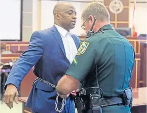  ?? JRED HUBER/STAFF PHOTOGRAPH­ER ?? An Orange County deputy secures Darryl Patterson on Tuesday. The same day, a jury found Patterson guilty of sexual battery and attempted sexual battery with physical incapacita­tion.