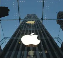 ?? MARK LENNIHAN/ THE ASSOCIATED PRESS ?? Apple’s third- quarter results announced Tuesday beat analysts’ estimates, but shares tumbled eight per cent in after- hours trading just the same.