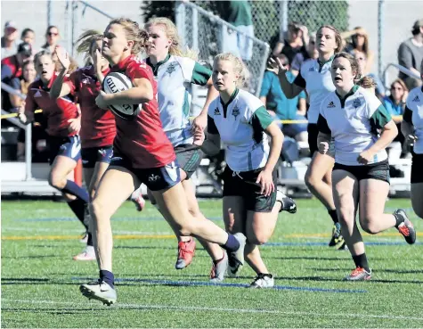  ?? PHOTO COURTESY OF BROCK UNIVERSITY ?? Brock's Sara Shaw, with the ball, on her way to scoring a try against Trent in university women's rugby Saturday at Alumni Field in St. Catharines.