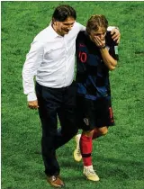  ?? ALEXANDER HASSENSTEI­N / GETTY IMAGES ?? Croatia coach Zlatko Dalic and star midfielder Luka Modric celebrate Wednesday’s 2-1 semifinal victory over England in Moscow. Not since Uruguay’s win in 1950 has a country of so few people (4.3 million) reached a World Cup final.