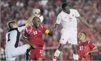  ?? CARLOS JASSO/ REUTERS ?? Panama’s goalkeeper Jaime Penedo makes a save as Canada’s Tosaint Ricketts ( 9) tries to score Tuesday in Panama City.