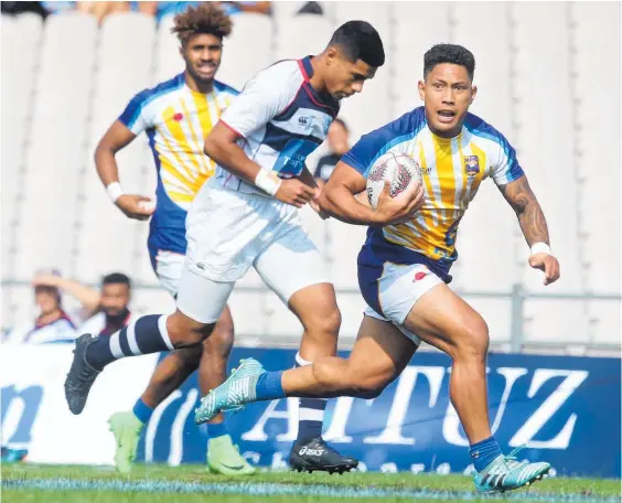  ?? Photo / File ?? Bay of Plenty’s Te Aihe Toma makes a break against Auckland during the plate final at the Bayleys National Sevens in Rotorua in January.