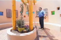  ?? ADOLPHE PIERRE-LOUIS/JOURNAL ?? Joe Atencio, family service counselor at Sunset Memorial Park, shows the Kiva area, which includes a portal to an undergroun­d ossuary in which people can deposit ashes of their loved ones.