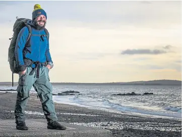  ?? ?? FUNDRAISIN­G: Chris Howard reaches Lower Largo beach. Picture by Mhairi Edwards.