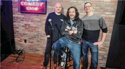  ?? Christian Abraham/Hearst Connecticu­t Media ?? New York Comedy Club owners Scott Lindner, Emilio Savone, middle, and Jim Panels, right, on the stage at the new comedy club in Stamford.