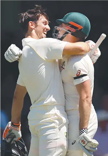  ?? Picture: GETTY IMAGES ?? BROTHERS IN ARMS: Mitchell Marsh (left) celebrates his ton with brother Shaun.