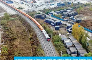  ??  ?? An aerial photo shows a China-Europe freight train bound for Helsinki, Finland departing from Putian Station of Zhengzhou, central China’s Henan Province, on Nov 20, 2020. —Xinhua photos