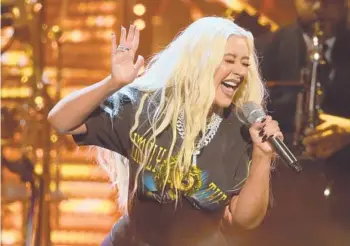  ?? DAVID RICHARD/AP ?? Christina Aguilera, who is seen performing Oct. 30, has released the Spanish-language EP“La Fuerza.”