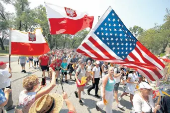  ??  ?? The pilgrimage started Saturday from St. Michael’s Church at 83rd Street and South Shore Drive in Chicago. On Sunday morning, the group walked the final 11 miles to Our Lady of Czestochow­a Shrine in Merrillvil­le, where they attended Mass.