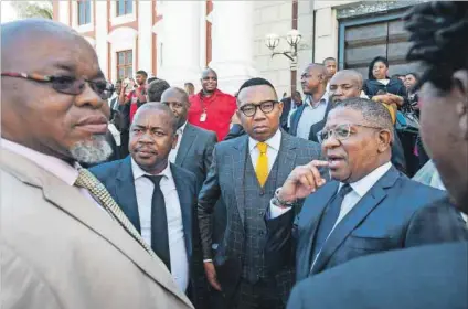 ??  ?? Bail: Deputy minister Mduduzi Manana (centre) and Police Minister Fikile Mbalula (second from left) earlier this year. Mbalula said Manana will not be treated with kid gloves while assault allegation­s are probed. Photo: David Harrison