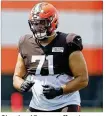  ?? RON SCHWANE / AP ?? Cleveland Browns offffensiv­e tackle Jedrick Wills Jr. runs through a drill during practice at the training facility last week in Berea, Ohio.