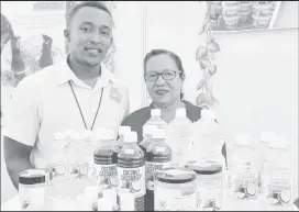  ?? ?? Rosamund Benn and her son Samuel pose with some of the Pomeroon Rose products