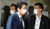  ?? PTI ?? Japanese Prime Minister Shinzo Abe wearing a face mask leaves after a press conference at his official residence in Tokyo Thursday