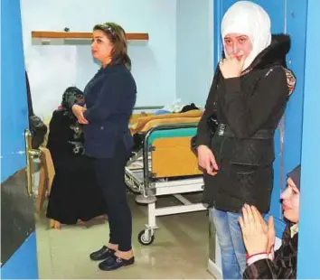  ?? AFP ?? Residents cry as wounded relatives are treated at a hospital in Damascus after a rocket hit a busy shopping area in the Jaramana area on Tuesday.