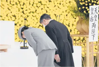  ?? TORU HANAI/REUTERS ?? WWII ceremony: Japan’s Emperor Naruhito, right, and Empress Masako bow Sunday during a ceremony to mark the 76th anniversar­y of Japan’s surrender in World War II at Budokan hall in Tokyo. Emperor Naruhito expressed “deep remorse” over his country’s wartime actions, but Prime Minister Yosihide avoided apologizin­g for his nation’s aggression.