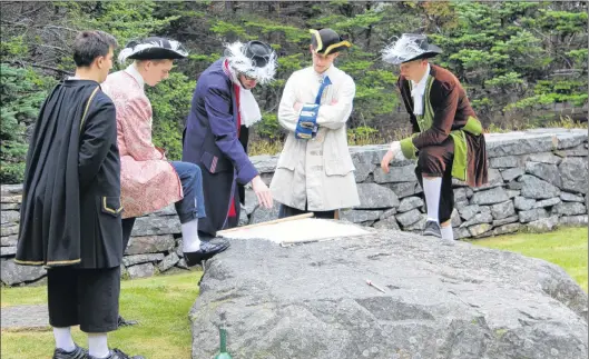  ?? SAM MCNEISH/THE TELEGRAM ?? Planning an attack on St. John’s to overthrow the English took place in Plaisance (Placentia) in the late 1690s. The planning of that attack was re-enacted during the “Faces of Fort Royal” which concluded its 2018 performanc­es at Castle Hill National Historic Site on Friday. Performers included (from left) Father Jean Boudain (Darren Ivany), Governor Jacques-francois de Brouillan (Shawn Bruce), Capt. Pierre Le Moyne d’iberville (Zack Newhook), Andrè Valliers (Robbie Pomeroy) and Augustin le Marde (Jackson Davis).