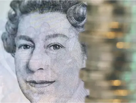  ?? Bloomberg ?? Queen Elizabeth II on a five-pound note. The UK’s economy, aligned with the European Union for the past 46 years, faltered this year as uncertaint­y over the outcome of Brexit rattled markets