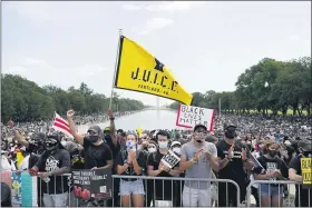  ?? CAROLYN KASTER - THE ASSOCIATED PRESS ?? People attend the March on Washington, Friday Aug. 28, in Washington, on the 57th anniversar­y of the Rev. Martin Luther King Jr.’s “I Have A Dream” speech.