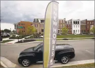  ?? Steve Helber / Associated Press ?? Despite a decline in April, new-home sales this year are 8.4 percent higher than in 2017.