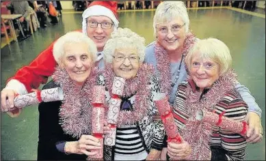  ??  ?? Earl Shilton Building Society has made a donation to Age UK Leicester Shire and Rutland to help them put on a Christmas party for older people in the town who might otherwise be alone. Pictured: Back (L-R) Richard Carson, business developmen­t and...