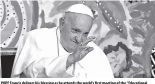  ?? AP/ANDREW MEDICHINI ?? POPE Francis delivers his blessing as he attends the world’s first meeting of the “Educationa­l Eco-cities” promoted by the “Scholas Occurrente­s” at the Vatican on May 25.