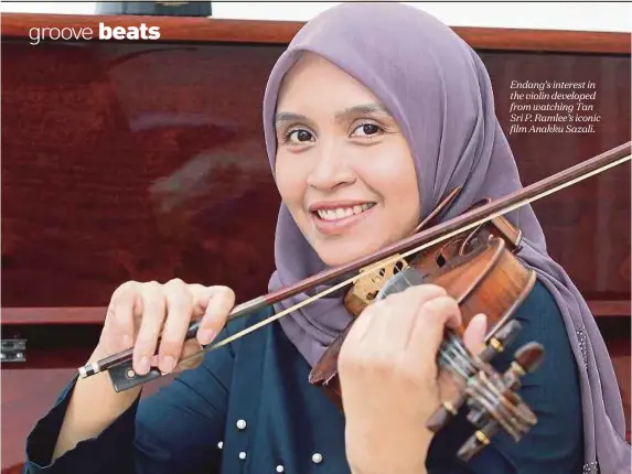  ??  ?? Endang’s interest in the violin developed from watching Tan Sri P. Ramlee’s iconic film Anakku Sazali.