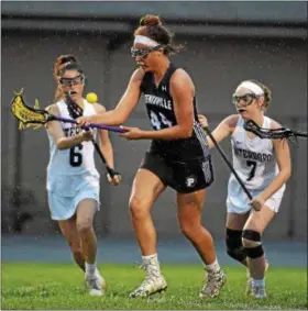  ?? PETE BANNAN - DIGITAL FIRST MEDIA ?? Phoenixvil­le’s Alana Lathan (44) handles a loose ball against Interboro in the opening round of the PIAA District 1 Class 2A girls lacrosse playoffs Wednesday evening. Phoenixvil­le went on to a 17-7 victory.