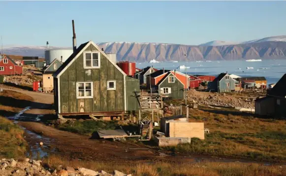  ?? WHITNEY SHEFTE/THE WASHINGTON POST ?? As the climate warms, the Arctic village of Qaanaaq, Greenland, has seen its age-old hunting economy evaporate, as it’s often not safe to take sleds or other vehicles over the ice.