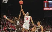  ?? DAVID JABLONSKI / STAFF ?? Rodney Chatman shoots against St. Bonaventur­e on Wednesday. The Dayton guard had eight points and two assists in an 86-60 win at UD Arena.