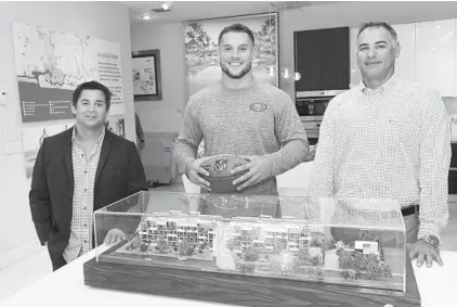  ?? MICHELE EVE SANDBERG/COURTESY ?? Nick Bosa, center, with managing partners of 30 Thirty North Ocean — Adam Adache, left, and Anthony Cavo.