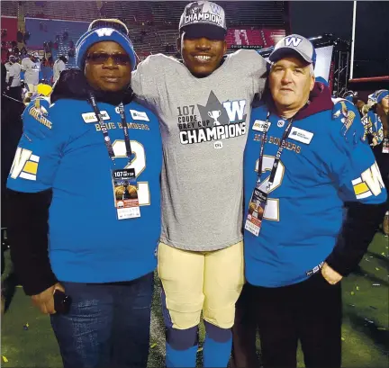  ?? PHOTO COURTESY OF KEN BUCHAN ?? Winnipeg Blue Bombers defensive end Jonathan Kongbo, center, joins his father Joachim, left, and Holy Cross Regional High School coach Ken Buchan after winning the Canadian Football League’s Grey Cup last year. Kongbo signed a futures contract with the 49ers on Dec. 31, 2019.